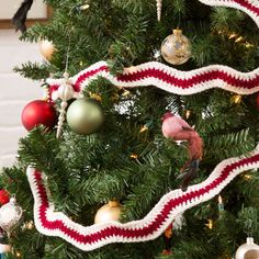 a christmas tree decorated with red, white and green ornaments