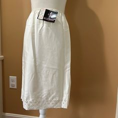 Lily Of France Vintage Skirt Slip Cream Size Small 100% Polyester Bottom Has Beautiful Embroidery Brand New With Original Tags! Elegant Embroidered Long Skirt, Elegant Bottoms With Embroidered Hem For Spring, Elegant White Skirt With Embroidered Hem, Elegant Embroidered Cotton Skirt, Elegant Cotton Skirt With Embroidery, Elegant Cotton Embroidered Skirt, Elegant Cotton Skirt With Floral Embroidery, Lingerie Gown, Pink Nightgown