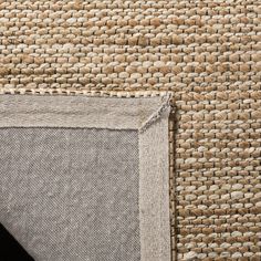 a close up view of an area rug that has been made with natural materials and is very soft