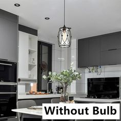 a kitchen with gray cabinets and white counter tops is featured in the article without bulb lights