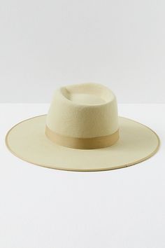 Top things off with this structured Australian wool hat featured in a round brim design with a ribbon on the crown. **Features:** Australian wool fabrication, round brim style, dipped crown, ribbon band, interior band for secure fit **Why We | Rancher Felt Hat by Lack of Color at Free People in Green, Size: M Elegant Felt Hat With Flat Crown For Spring, Elegant Spring Felt Hat With Flat Crown, Beige Wool Fedora With Curved Brim, Beige Fur Felt Brimmed Hat, Elegant Panama Hat With Flat Crown For Winter, Elegant Flat Crown Panama Hat For Winter, Spring Brimmed Fur Felt Fedora, Kentucky Derby Fur Felt Boater Hat With Flat Brim, Chic Fur Felt Hat With Short Brim