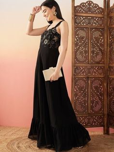 Black Sequence Embroidered Flared Maxi Ethnic Dresses – Inddus.com Festive Evening Dress With Embroidered Neckline, Sleeveless Embellished Dress For Eid, Embellished Sleeveless Dress For Eid, Chic Floral Embroidered Maxi Party Dress, Chic Maxi Dress With Floral Embroidery For Party, Summer Anarkali Embellished Dress, Evening Maxi Dress With Embroidered Neckline, Festive Maxi Dress With Embroidered Neckline, Chic Floral Embroidery Maxi Dress For Evening