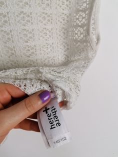 Beautiful off-white sheer crochet knit crop top, fringed hem/ Excellent vintage condition. Would fit size XS. Model wears size 8-10 UK, S-M US, is 160 cm tall and weighs 54 kg. All of our items are freshly laundered with quality detergents and fabric softeners, absolutely ready to wear the moment you receive them! Keep in mind, this item is vintage and subtle signs of passing time may be present, adding to its character and making it even more worthy of your love. For more info, additional photo Fitted Lace Crochet Top With Pointelle Knit, White Open Knit Lace Top, White Lace Top With Open Knit Detail, White Cropped Crochet Top With Lace Trim, Fitted White Tops With Fringe, Stretch Lace Top With Crochet Trim, White Fitted Fringe Tops, Stretch Lace Crochet Top With Open Knit, Lace Crochet Top With Open Knit Stretch