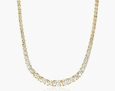 This 14K yellow gold Riviera tennis necklace is a stunning piece of jewelry that will make you shine. It features 4.00 carats total weight of round brilliant diamonds that gracefully graduate towards the center, creating a spectacular effect. The diamonds are set in a classic tennis style, and the necklace secures with a box clasp. This necklace is made of high-quality materials and is built to last. It is a perfect addition to any woman's jewelry collection. It is elegant, sophisticated, and ti Yellow Gold Tennis Necklace For Anniversary, Dazzling Yellow Gold Tennis Necklace, Anniversary Yellow Gold Round Tennis Necklace, Anniversary Yellow Gold Tennis Necklace, Gold Tennis Necklace With Brilliant Cut, Gold Brilliant Cut Round Tennis Necklace, Gold Tennis Necklace With Round Cut For Anniversary, Tennis Style, Elegant Sophisticated