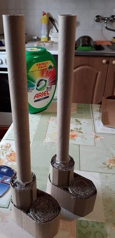 two rolls of toilet paper sitting on top of a kitchen counter next to each other