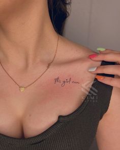 a woman's chest with the word, the girl can written on her chest