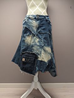 a skirt made out of old jeans on a mannequin with a cell phone in the pocket