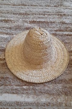 📌 DESCRIPTION: Authentic Berber Hat , Moroccan Berber Hat Chefchawen, Rif Mountain, North Morocco. This Beautiful straw hat is handwoven in Chefchawen from natural palm leaves by Moroccan handicrafts-man. 📌 DETAILS : Full hat diameter :14.56 inch / 37 cm Crown height: 5.11 inch / 13 cm Width of outer edges : 3.93 inch / 10 cm (All the little details are in the pictures) 📌 MATERIAL : Natural palm leaves 📌 COLOR: as shown in the image 🚚📦 SHIPPING & PRODUCTION: Order Production: 1-3 days II n Artisan Natural Colored Sun Hat For Vacation, Artisan Natural Sun Hat For Vacation, Artisan Palm Leaf Sun Hat For Beach, Traditional Palm Leaf Straw Hat For Summer, Handmade Palm Leaf Sun Hat For Vacation, Traditional Straw Hat For Beach, Traditional Natural Straw Hat For Beach, Traditional Straw Hat For The Beach, Traditional Natural Straw Hat