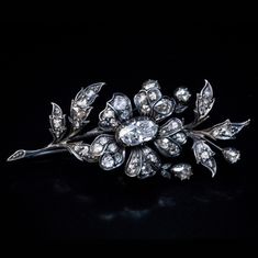 Circa 1860  This classic Victorian floral brooch is crafted in silver-topped gold (front - silver, back - gold). It is embellished with antique rose cut diamonds of various shapes and sizes (H-I-J color, VS-SI clarity).  Length is 55 mm (2 1/8 in.) Diamond Flower Brooch, Antique Cushion Cut Diamond, Art Nouveau Antiques, Gold Fronts, Art Deco Pendant, Faberge Eggs, Floral Brooch, Turquoise Flowers, Gold Gemstone Ring