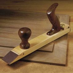 a wooden stamper sitting on top of a piece of wood