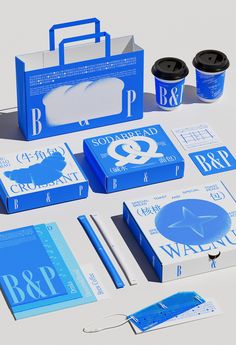 blue and white packaging design for an ice cream brand, with two cups of coffee next to it