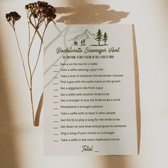 Printable bachelorette scavenger hunt list with a nature-inspired design, presented on a wooden backdrop with dried flowers, for a memorable camp bachelorette experience. Forest Theme Bachelorette Party, Camp Themed Bachelorette Party Games, Camp Bachelorette Party Games, Camp Bachelorette Survival Kit, Bachelorette Party Camping Theme, Wilderness Bachelorette Party, Camp Rules Bachelorette, Bachelorette Party Games Scavenger Hunt, Bachelorette Party Scavenger Hunt