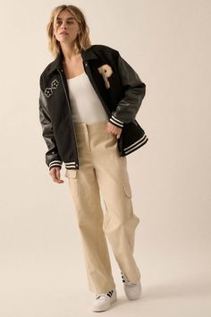 Felt and faux leather varsity bomber jacket. Flowers and letter "P" chenille applique patches. Contrasting faux leather sleeves. Side pockets with faux leather trim. Collared neckline. Zip-up front closure with snaps at top and bottom. Long sleeves. Dropped shoulders. Striped ribbed knit cuffs and hem. Yoke back. Quilted lining. Loose fit. 80% Polyester, 20% Cotton. Imported. Designed in LA. Model wears size S. Fall College Style Varsity Jacket With Letter Patch, College Style Varsity Jacket With Letter Embroidery For Fall, Baseball Collar Outerwear With Patches For Fall, Fall Outerwear With Patches And Baseball Collar, Fall Varsity Jacket With Pockets, Black Varsity Jacket With Patches For Fall, Varsity Jacket With Pockets For Fall, College Varsity Jacket With Pockets For Fall, Fall College Varsity Jacket With Pockets