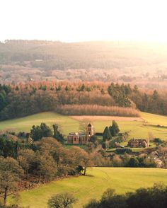 an aerial view of the countryside with houses and trees