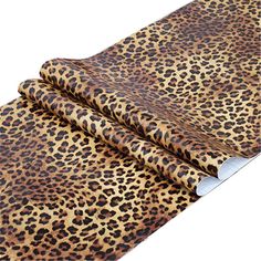 a leopard print fabric on a white background