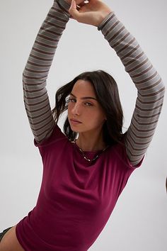 '90s-inspired BDG long-sleeve tee in a slim & cropped fit. Featuring a boatneck & cap sleeve tee with a contrasting long-sleeve for an effortless layered look. Only at Urban Outfitters. Features BDG Sloane layered twofer tee Layered long sleeve tee Soft and stretchy knit Wide boatneck and cap sleeves with a layered contrasting long-sleeve Slim body-skimming fit Cropped length Easy pull-over style Only at Urban Outfitters. Contents + Care 100% Cotton Machine wash Imported Size + Fit Model in Grey Layered T Shirts Long Sleeve, Long Sleeve With Short Sleeve Over It, Tank Top Over Long Sleeve, Long Sleeve And T Shirt Layering, Long Sleeve Under Shirt, Urban Outfitters Clothes, Cap Sleeve Tee, Layered Long Sleeve, Cold Outfits