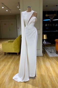 Luxury Asymmetrical One Shoulder Wedding Dress, White Gala Dresses With Sleeves, Dresses By Valdrin Sahiti, Luxury Reception Dress With Asymmetrical Neckline, Luxury Fitted White One Shoulder Dress, Luxury White Fitted One Shoulder Dress, Luxury White Maxi Dress With Sweep Train, White Gala Dresses Long Sleeve, Luxury White Dress With Back Zipper