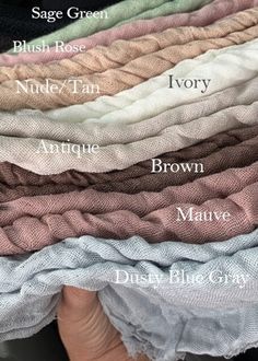 several different colors of fabric stacked on top of each other with the names of them