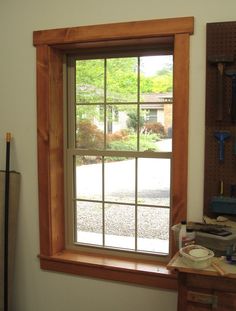 a room with a window and tools on the table