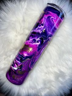 a purple and black marbled glass tumbler on a white furnishing area