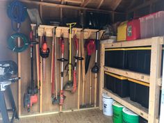 the inside of a storage shed with tools and other items in it's bins