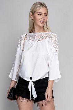 This elegantly designed classic blouse features a round neck with lace trim, three-quarter dolman sleeves, and a bow-tie waist. Crafted from a comfortable and lightweight fabric, this blouse is perfect for special occasions or everyday formal wear The elegant design is completed with a lace trim around the neck and bow-tie waist for a timeless look. The lightweight fabric ensures all-day comfort for any occasion. 🎀💃. Lace trim blouse with tie- Pattern type : solid- Neck line : round neck with Feminine V-neck Lace Top With Lace Collar, Brunch V-neck Blouse With Lace Trim, Feminine V-neck Blouse With Lace Trim, Feminine Lace Top With V-neck And Lace Collar, White Non-stretch Blouse With Lace Trim, Lace Trim Blouse, Saint John, Classic Blouses, Tie Pattern