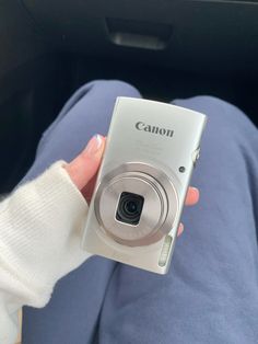 a person holding a camera in their hand