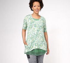 Delightfully designed to show off an easy-breezy layered look, this tank-and-tee twinset takes the guesswork out of everyday outfitting. The tee boasts a bold allover print, while the color-coordinated lace-hemmed tank peeks out the bottom in fab fashion. From LOGO by Lori Goldstein®. Green Relaxed Fit T-shirt For Layering, Trendy T-shirt For Spring Layering, Casual Spring T-shirt For Layering, Casual Layered Tops For Spring, Casual Spring Layering T-shirt, Green T-shirt For Summer, Graphic Print T-shirt For Spring Layering, Trendy Graphic Print Tops For Layering, Graphic Print T-shirt For Spring