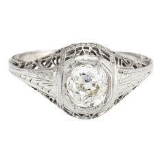 Elegant & finely detailed Art Deco era ring (circa 1920s to 1930s), crafted in 18 karat white gold.   Centrally mounted estimated 0.60 carat Old Mine cut (estimated at K-L colour and SI2 clarity).     The ring epitomises vintage charm and would make a lovely alternative engagement ring. The lacy filigree gallery mount terminates to the round bezel setting. The diamond faces up nicely and offers good sparkle and fire. Also great worn as a right hand or cocktail ring.    The ring is in very good c Antique Engagement Rings Victorian, Antique Ring Settings, Engagement Jewellery, Art Deco Diamond Ring, Deco Diamond Ring, Antique Diamond Engagement Rings, Edwardian Engagement Ring, Detailed Art, Victorian Engagement Rings