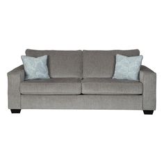 a gray couch with two blue pillows on the arm and one light blue pillow sitting on top of it