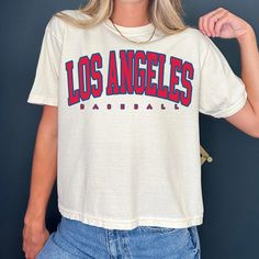 Vintage Los Angeles Baseball cropped Tshirt Los Angeles Shirt Baseball T-shirt retro Los Angeles Tee Los Angeles Gift Comfort Color Crop Top -Please check Color and Size Charts before placing the order. You can find them in the listing's photos (Depending on what device you are viewing this listing colors may vary slightly). -Returns and exchanges are accepted only if there are defects "No Extra Costs" We create custom t-shirts with great designs for everyone's liking. If you don't find the size I Love Los Angeles, Retro Los Angeles, Cropped Tshirt, Los Angeles Shirt, Colorful Crop Tops, Vintage Los Angeles, Boxy Tee, Comfort Color, Crop Tshirt