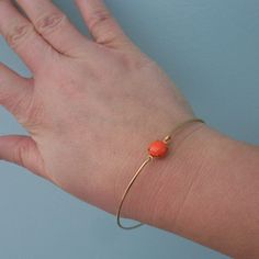 Coral Red Bangle Bracelet Alessa  Gold Coral by FrostedWillow, $12.95 Gold Red Coral Bracelets As Gift, Gold Red Coral Bracelets For Gifts, Gold Red Coral Bracelet As A Gift, Gold Bracelets With Red Coral As Gift, Gold Red Coral Bracelet For Gift, Elegant Red Coral Adjustable Bracelet, Elegant Adjustable Red Coral Bracelet, Red Brass Jewelry With Round Beads, Adjustable Red Coral Bracelets