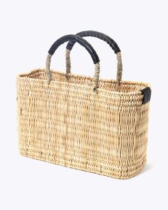 a wicker basket with two handles is shown