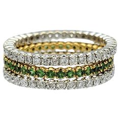 two tone gold and green diamond ring set with white diamonds on each side, in the middle