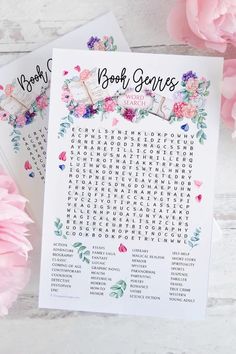 two printable book search cards with pink flowers on the table next to each other