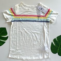 Fabric: Pure Cotton Jersey Fabric Fit: Classic, Comfortable Regular Fit Printed Multi-Colored Stripes With Roxy Print On Chest Trendy White Top, Trendy White Top For Playwear, Multicolor Spring T-shirt For Play, Playful White Top With Rainbow Print, Playful Cotton Tops With Rainbow Print, Playful Cotton Top With Rainbow Print, Fun White Top With Rainbow Print, Fun White Tops With Rainbow Print, Trendy Multicolor Tops For Playwear