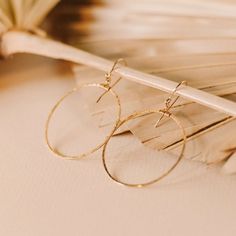 They are beautiful, light, and perfect for everyday use!  Details: Hoops are 2" x 2"  Ear wire is 1" long Wire is hand-shaped and lightly hammered for texture All of our jewelry is handmade to order just for you! Each piece will be unique and may vary slightly from what is pictured. Everyday Hammered 14k Gold Filled Earrings, Dainty Adjustable Hammered Earrings, Adjustable Hammered Circle Earrings, Adjustable Hammered Minimalist Earrings, Hammered Drop Wrap Earrings As A Gift, Hammered Drop Wrap Earrings For Gift, Minimalist Hammered Adjustable Earrings, Hammered Minimalist Adjustable Earrings, Hand Forged 14k Gold Filled Drop Earrings