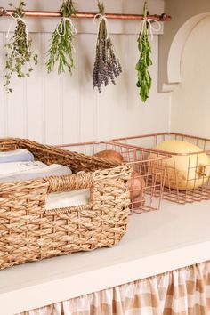 wicker baskets are hanging on the wall next to bread and other items in front of them