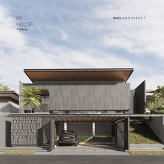 a car is parked in front of a house with an awning on the roof