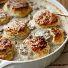 a casserole dish filled with biscuits and cream