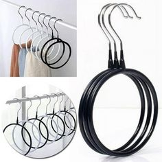 a set of five circular hangers on a wall next to a rack with six rings