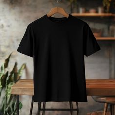 Soft and breathable cotton. Moisture wicking technology keeps you cool and dry. Label-free to prevent irritation. Classic length to tuck into pants with ease. Durable stitching. Flat collar. Mockup Tshirt Black, Black T Shirt Mockup, Black Shirt Mockup, Plain Black Tee, Tshirt Prints, Office Closet, Kaos Oblong, Shirt Clips