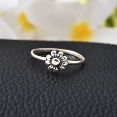 Stamped 925 Flower Jewelry, Flower Shape Stackable Rings For Anniversary, Flower Shaped Stackable Promise Rings, Stackable Flower Promise Rings, Nickel-free Flower Ring For Anniversary, Dainty White Gold Sterling Silver Flower Ring, Dainty White Gold Flower Ring In Sterling Silver, Sterling Silver Flower Ring Gift, Dainty Sterling Silver Flower Ring For Promise