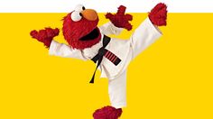 the sesame character is doing karate moves