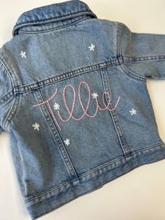 a denim jacket with the word todd written on it