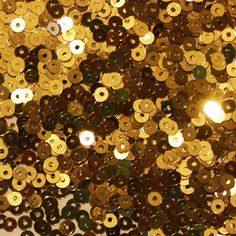 Round sequins with a center hole. 3000 sequins per pack. Sequins measure 3mm. Made in USA. Shiny metallic materials have a shiny metallic surface. They have a polished metal look and are a very traditional sequin material. The metallic sheen gives the material an almost ""mirror"" appearance. Size: 3 mm.  Color: Gold. Gold Theme Party, Drapery Trim, Black And Gold Theme, Sequin Flats, Jewel Colors, Gold Theme, Exterior Trim, Sequins Embroidery, Gold Sequins