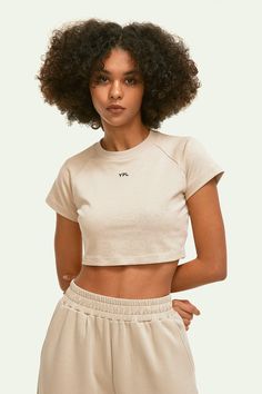 This YPL Crop Finesse Short Sleeve is the perfect addition to your wardrobe. Featuring a cropped short sleeve, on-trend silhouette and soft, sueded performance cotton, you'll get the modern style you're looking for without compromising on comfort. Plus, a signature logo on the front adds the perfect finishing touch. Athleisure Women, A Signature, Yoga Set, Black Khakis, Cotton Logo, Color Khaki, Signature Logo, Bra Tops, Infant Tees