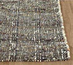 an area rug with black and white squares on it