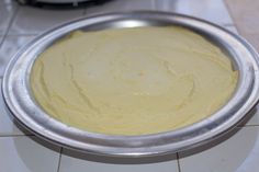 a metal pan filled with batter on top of a counter