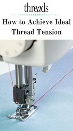 the sewing machine is stitching threads on it's side with red thread